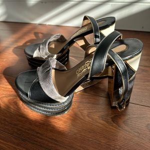 Salvatore Ferragamo GAGA Platform size 7. Authentic!! Gold and Black Slingbacks